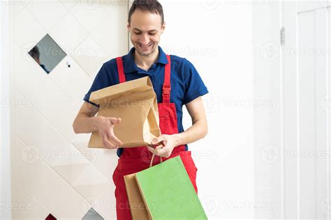 Two Boxes With Fast Food Being Carried By Delivery Man In Uniform For