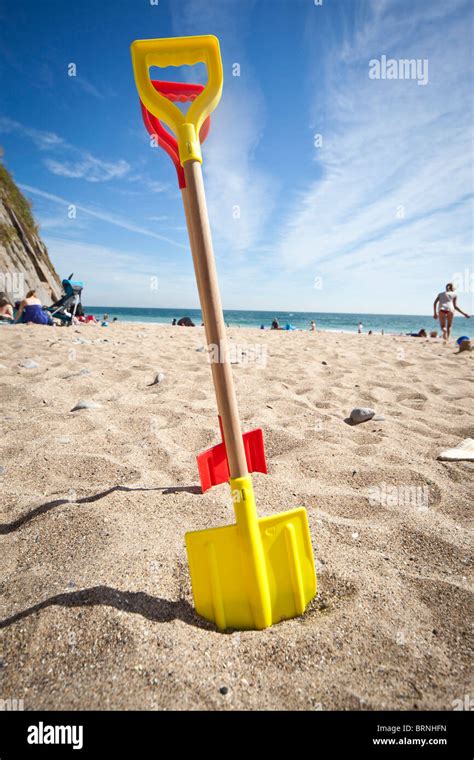 Two Spades Left On The Beach Stock Photo Alamy