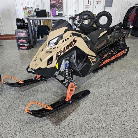 2024 Polaris® 850 Rmk Khaos 155 Gloss Blackmilitary Tanorange Burst