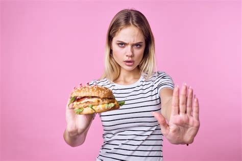 Premium Photo Cute Blonde Girl In Striped Tshirt Hamburger Closeup Fast Food Lifestyle