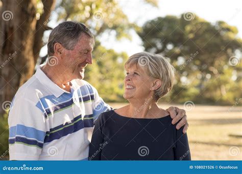 Portrait Of American Senior Beautiful And Happy Mature Couple Around 70 Years Old Showing Love