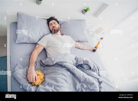 Photo Of Funny Mature Guy Sleepwear Pajama Lying Bed Sleeping After Hagover Indoors Home House