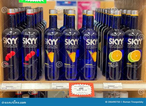 Skyy Vodka Blue Bottle On A Wooden Table With Grey Wall Editorial