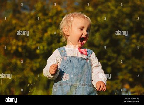 Baby Tasting The Plant Stock Photo Alamy