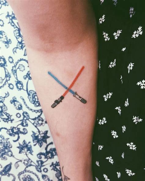 The Art Of The Minimalist Lightsaber Tattoo A Guide To Subtle Star