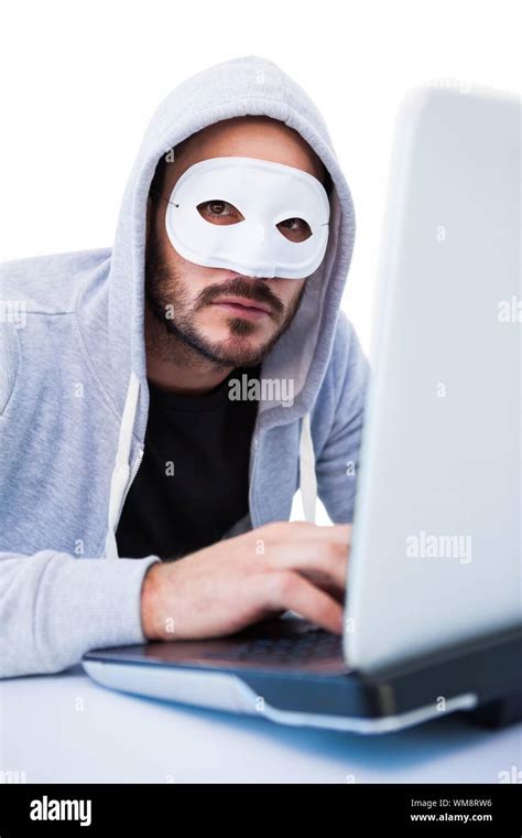 Hacker Anonymous Mask Using Laptop Hi Res Stock Photography And Images