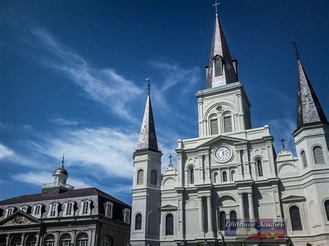 A Church With Steeples And A Clock On The Front