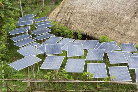 Solar panels in tropical garden Stock Photo | Adobe Stock