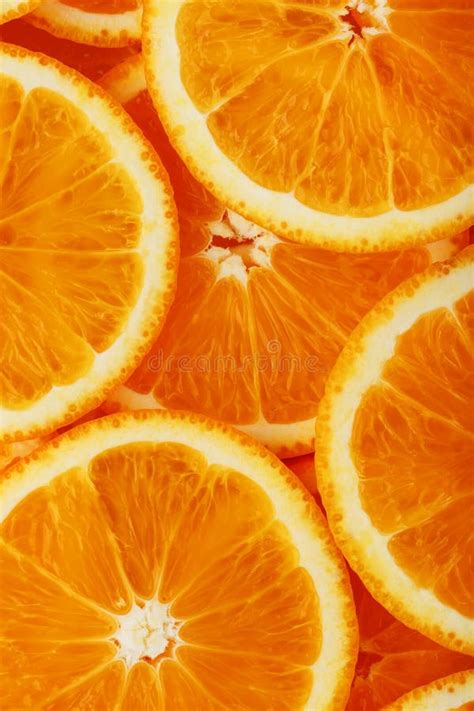 Fatias De Laranja Madura Retroiluminadas Como Um Fundo Estrutural Tela