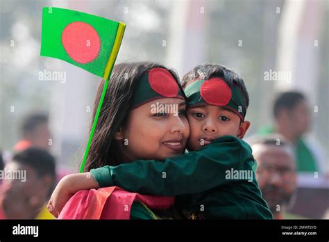 A Bangladeshi Mother And Son Participate In A Rally To Mark Victory Day