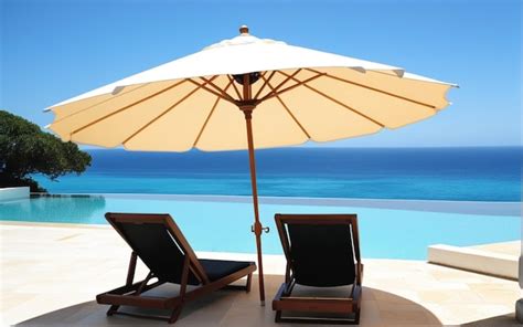 Premium Photo Umbrella And Chair Around Swimming Pool