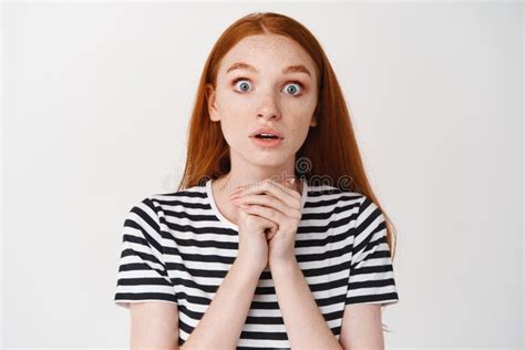 Portrait Of Cute Young Girl With Red Curly Hair And Freckles Smiling Looking At Camera Stock