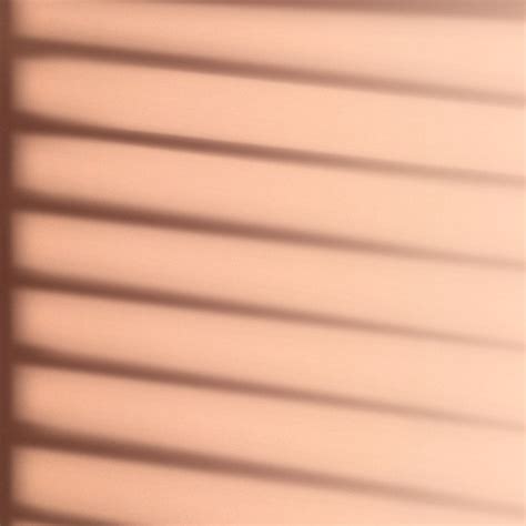 Background Psd With Window Blind Shadow During Golden Hour Premium