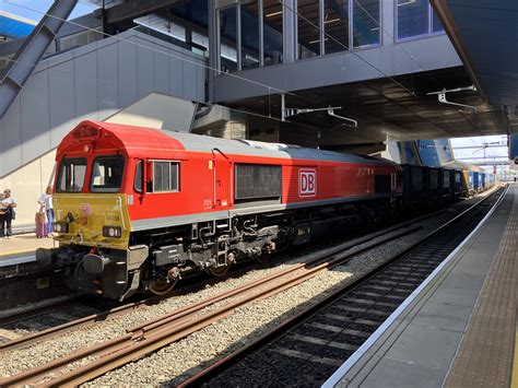 British Rail Class 66 Unit Number 66056 Diesel Locomotive Passes Reading Railway Station With