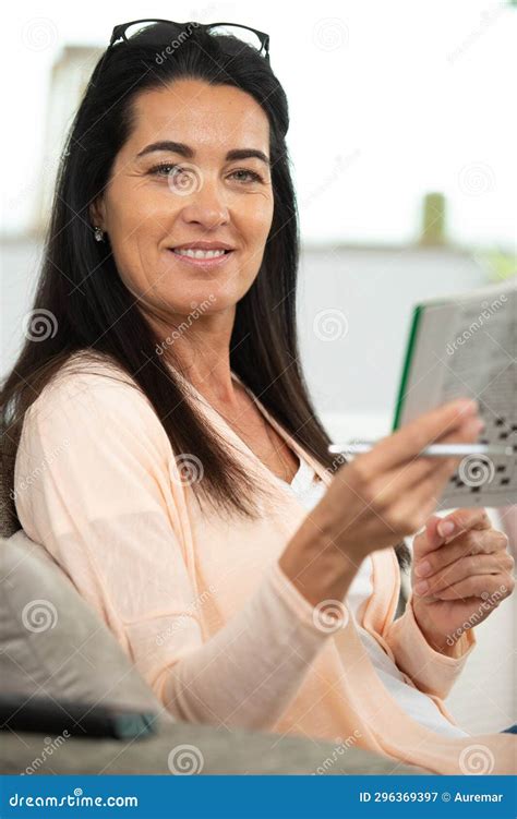 Smiling Happy Woman Lying On Sofa Reading Magazine Stock Image Image