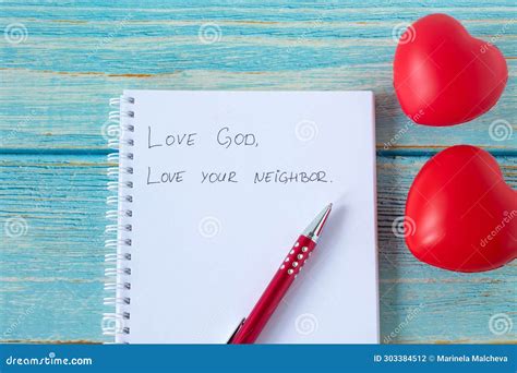 Love God And Your Neighbor Handwritten Quote In Notebook With Pen And