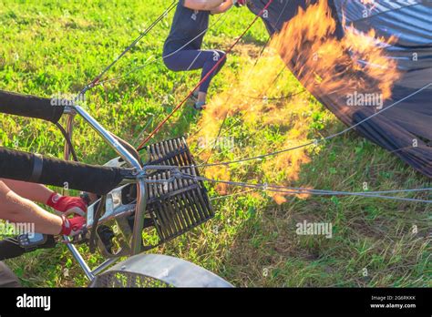 Preparing For A Flight In A Hot Air Balloon A Burner With Its Super Hot Flame Light Up Inside Of