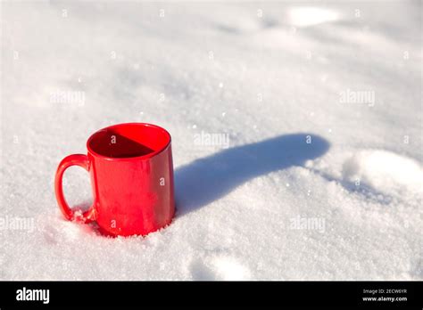 Steaming Cup Of Hot Coffee Tea Or Chocolatemilk In The Cold Fresh White Snow Winter Cozy Drink