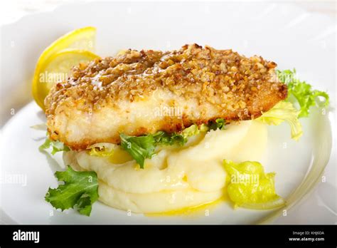 Baked Cod Fish With Mashed Potato Stock Photo Alamy