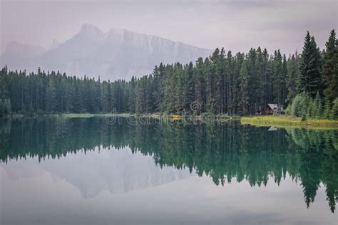 Cabin In Front Of Mount Rundle At Two Jack Lake In Alberta Cana Stock