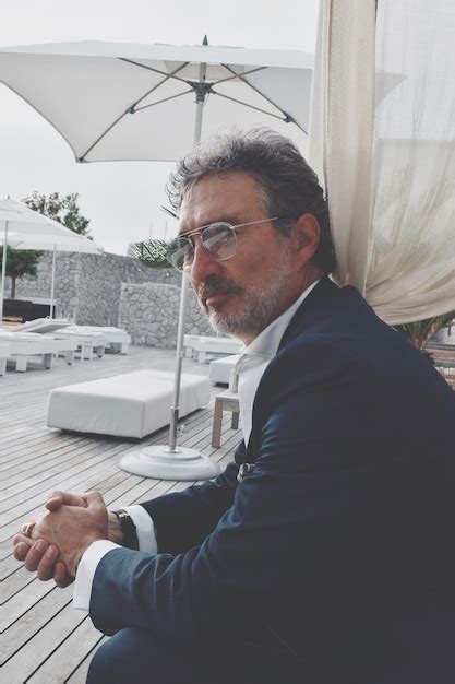 Premium Photo Side View Portrait Of Mature Man Sitting