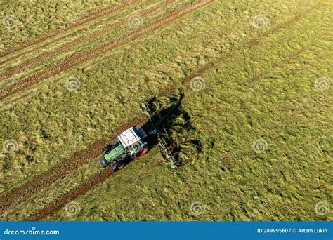 Harvesting And Drying Hay The Grass Tedder Turns Freshly Cut Grass