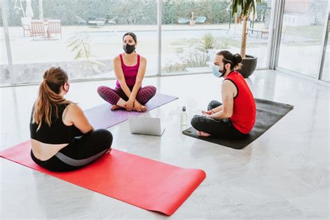 Group Of Young Latin People In Yoga Class Wearing Medical Mask In Latin