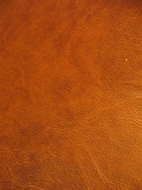 A Close Up View Of A Brown Leather Surface