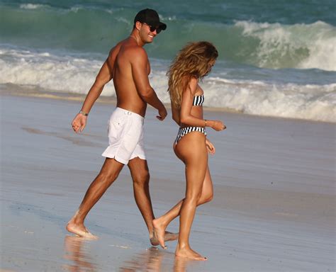 Megan McKenna Hits The Beach In A Striped Bikini In Barbados Photos