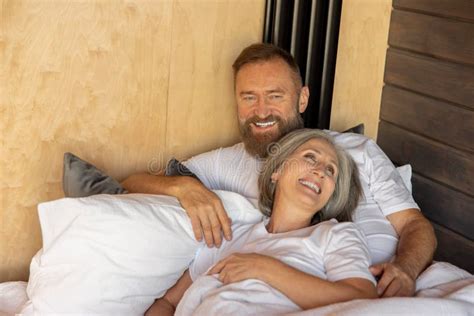 Mature Couple Staying In Bed And Looking Happy Stock Image Image Of Wellbeing Relaxed 268625895