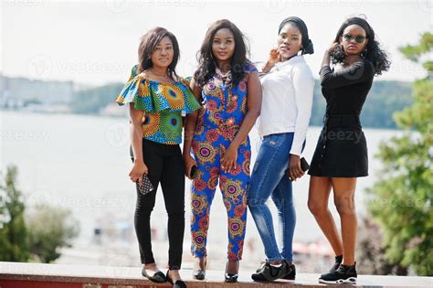 Group Of Four African American Girls Posed Outdoor In Good Mood