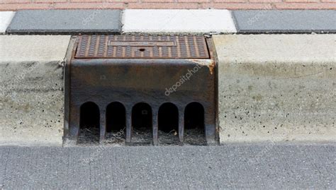 Sidewalk with street drain — Stock Photo © eggheadphoto #11925855