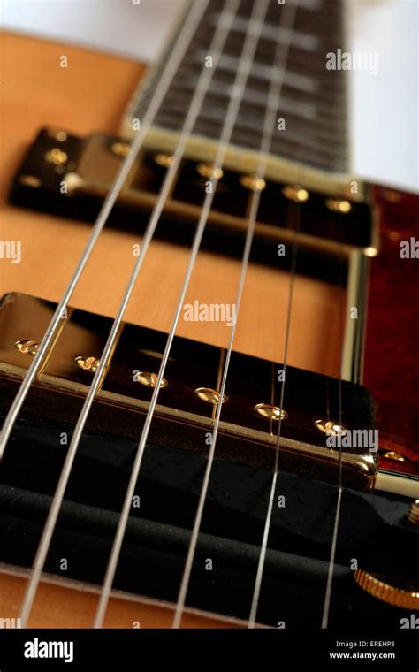 Close Up Detail On A Semi Acoustic Guitar By Epiphone Joe Pass Model Pick Ups And Strings