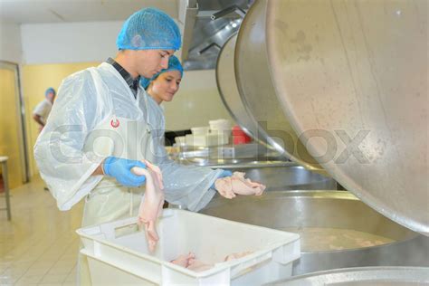 Factory Operative Dropping Chickens Into A Vat Stock Image Colourbox