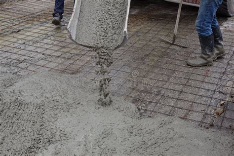 Workers Pouring Wet Concrete Using Concrete Bucket Industrial