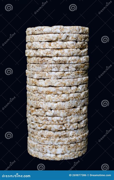 A Stack Of Puffed Rice Cakes Isolated On A Black Vertical Background