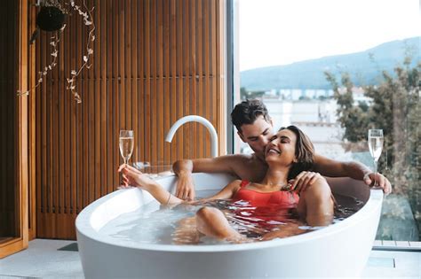 Premium Photo Beautiful Couple Enjoying A Relaxing Bath With Champagne