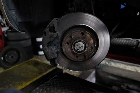 Replacement of disc brakes stock image. Image of mechanic - 104940767