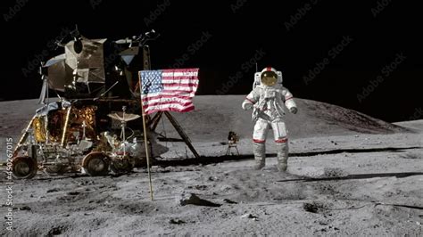 Astronaut jumping on the moon and saluting the American flag. Stock ...