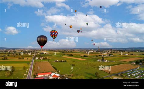 An Aerial View Of Many Hot Air Balloons Launching And Floating Away