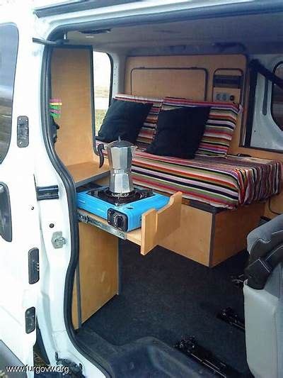 The Interior Of A Van With An Open Bed And Storage Compartment On The