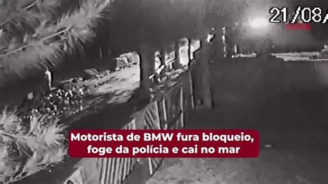 Motorista de BMW fura bloqueio foge da polícia e cai no mar Vídeo