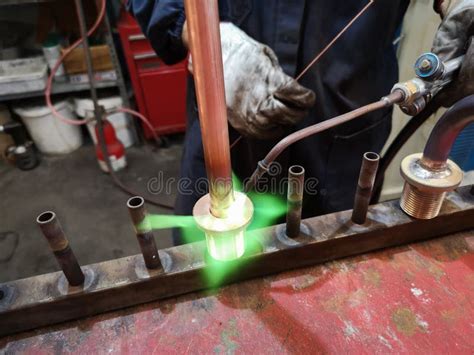 Soldering Brass Fitting On Copper Pipe With Torch Of Welding Stock