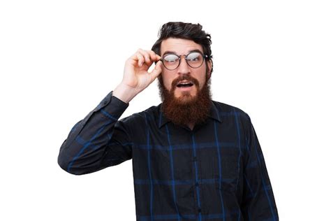 Premium Photo Photo Of Surprised Bearded Man Touching His Glasses