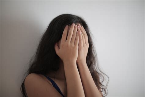 Woman Covering Her Face With Her Hands · Free Stock Photo