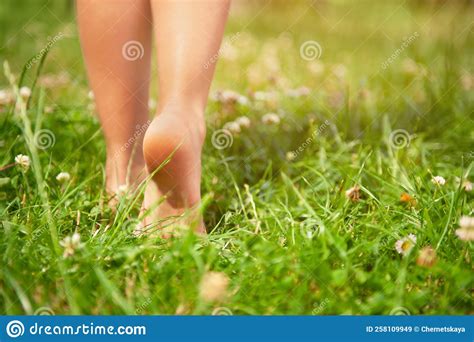 Child Walking Barefoot on Green Grass Outdoors, Closeup. Space for Text ...