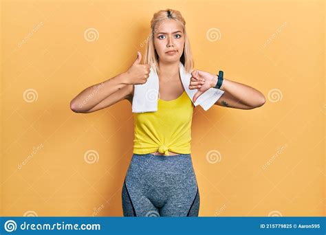 Beautiful Blonde Sports Woman Wearing Workout Outfit Doing Thumbs Up