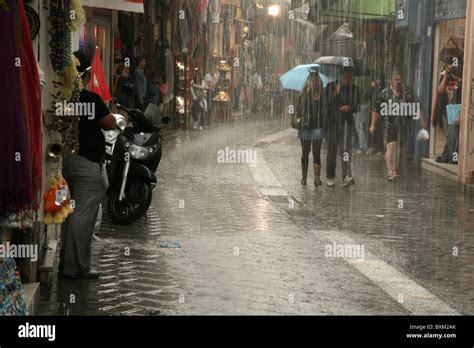 Heavy Rain In A Shopping Area At Ifestou Street In Athens Greece Stock