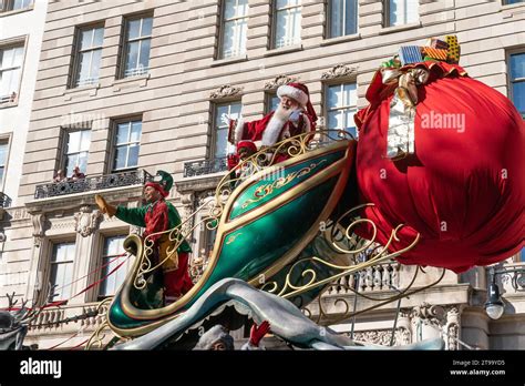 Santa Claus And Mrs Claus Ride On A Float During 97th Annual 2023 Macy