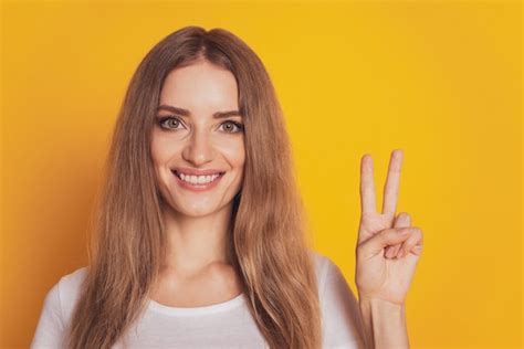 Premium Photo Portrait Of Cute Woman Showing V Sign Isolated On